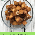 Tired of that squishy tofu texture? Learn how to cook crispy, oil-free tofu with this healthy vegan recipe. It is easy to make and baked in the oven! It is the perfect add-in for a healthy, simple dinner or lunch bowl. Repin and check out the recipe on my blog, breesveganlife.com. #breesveganlife #crispytofu #veganrecipes #oilfreetofu #glutenfree