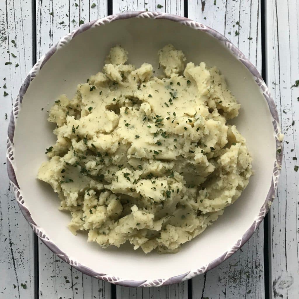 bowl of mustard and dill mashed potatoes