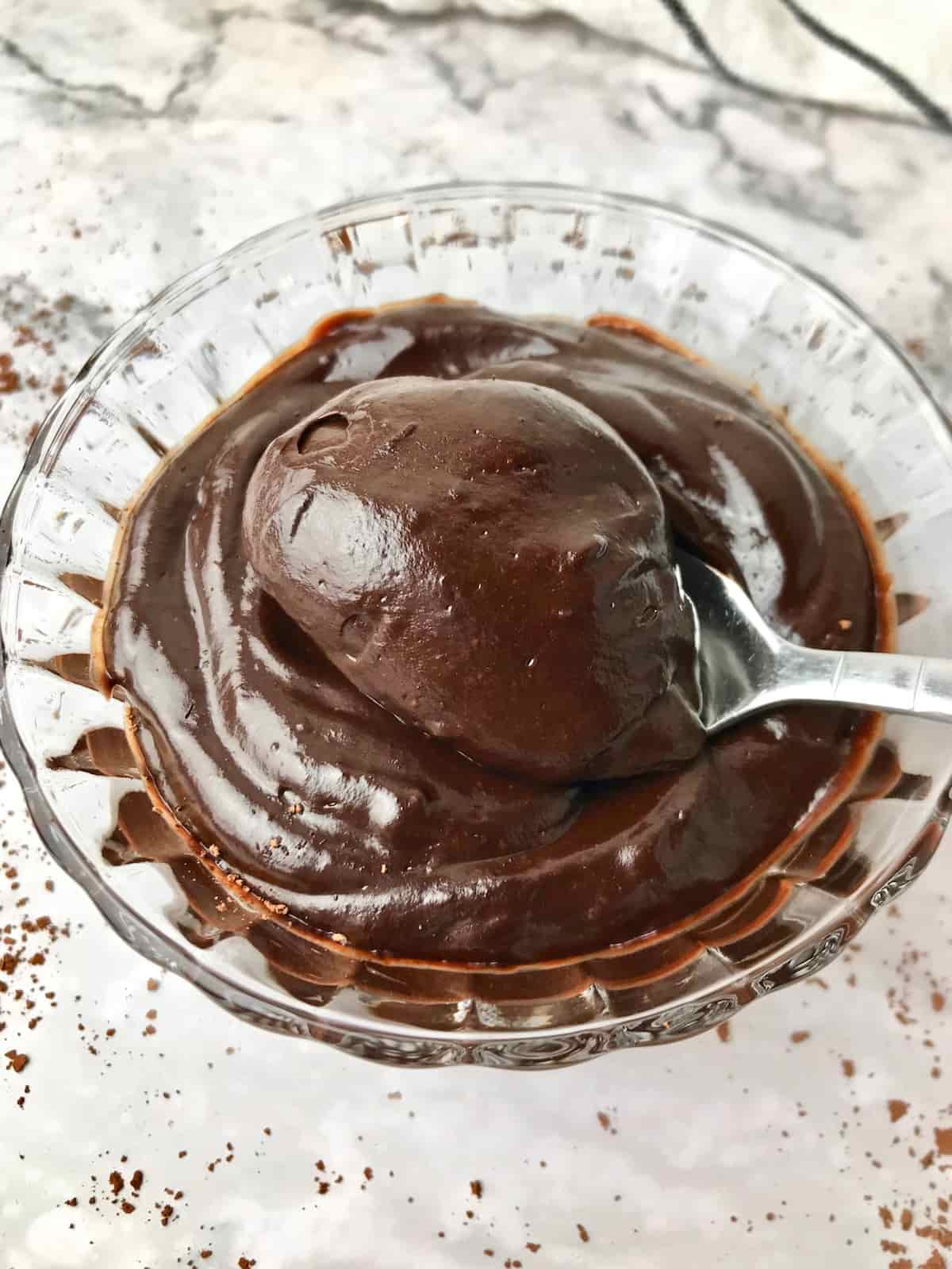 A spoonful of avocado chocolate pudding.