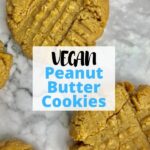 Peanut butter cookies on a table with text overlay that says, "Vegan Peanut Butter Cookies."