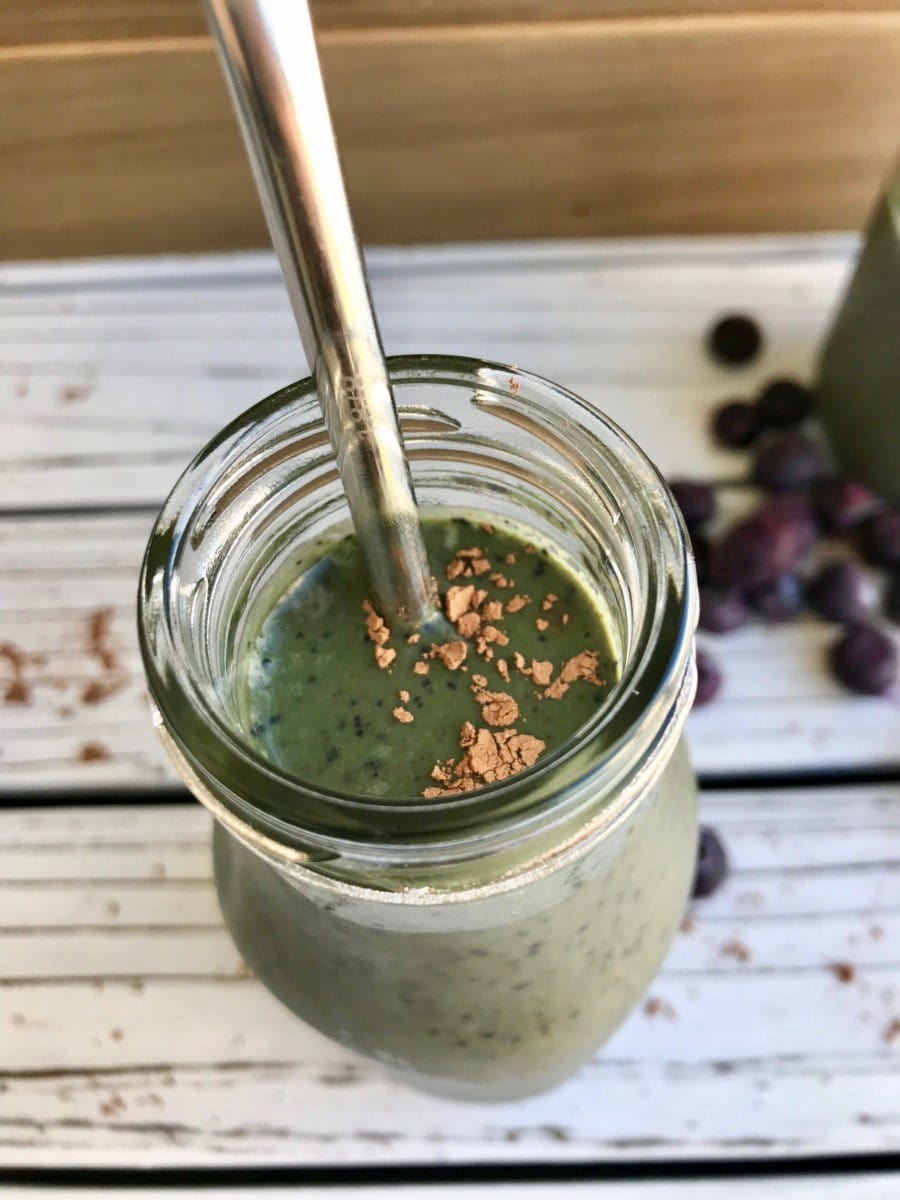 Green smoothie with blueberries and cocoa powder. 