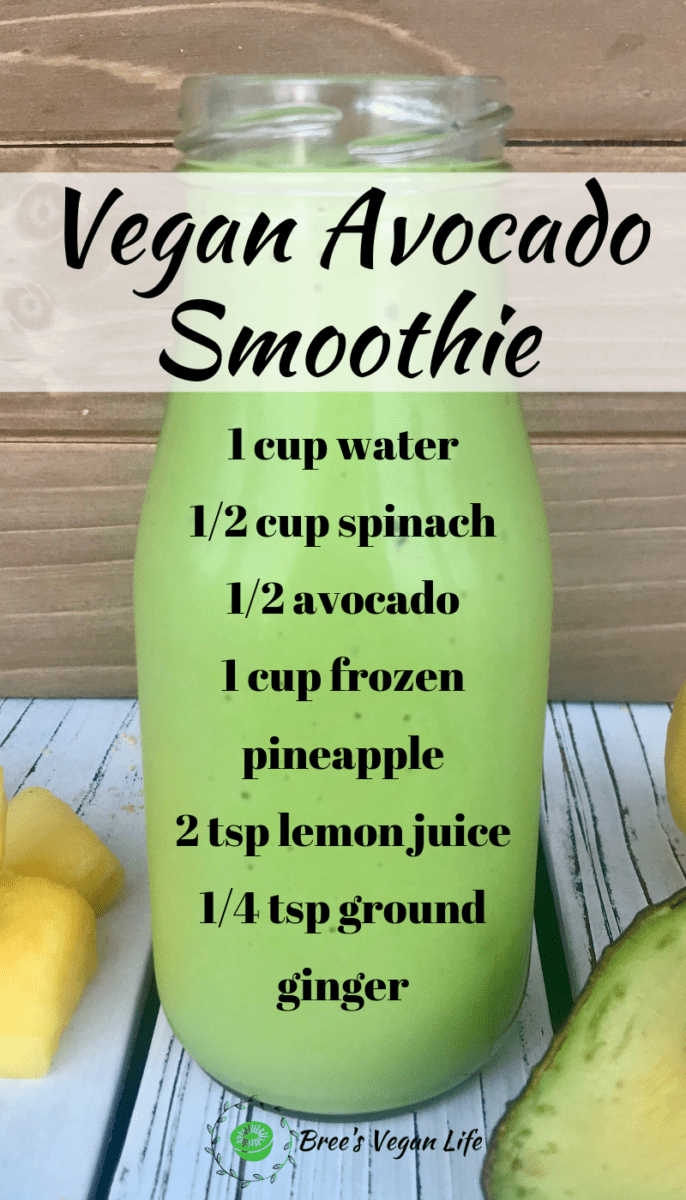 A green smoothie with ingredients listed on the glass.