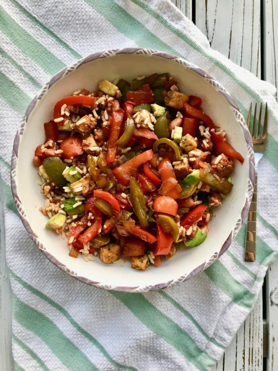 Vegan bowl recipe with mixed veggies, brown rice, beans, and tofu.