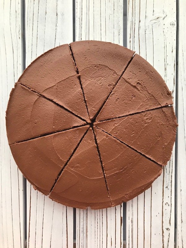 Overhead view of chocolate pie cut into 8 slices.