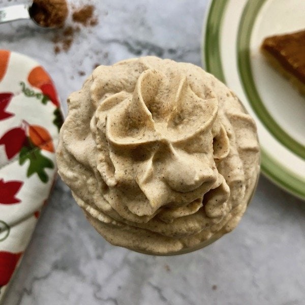 Close-up of pumpkin whipped cream in a jar.