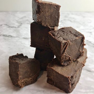 chocolate peanut butter freezer fudge stacked on top of each other.