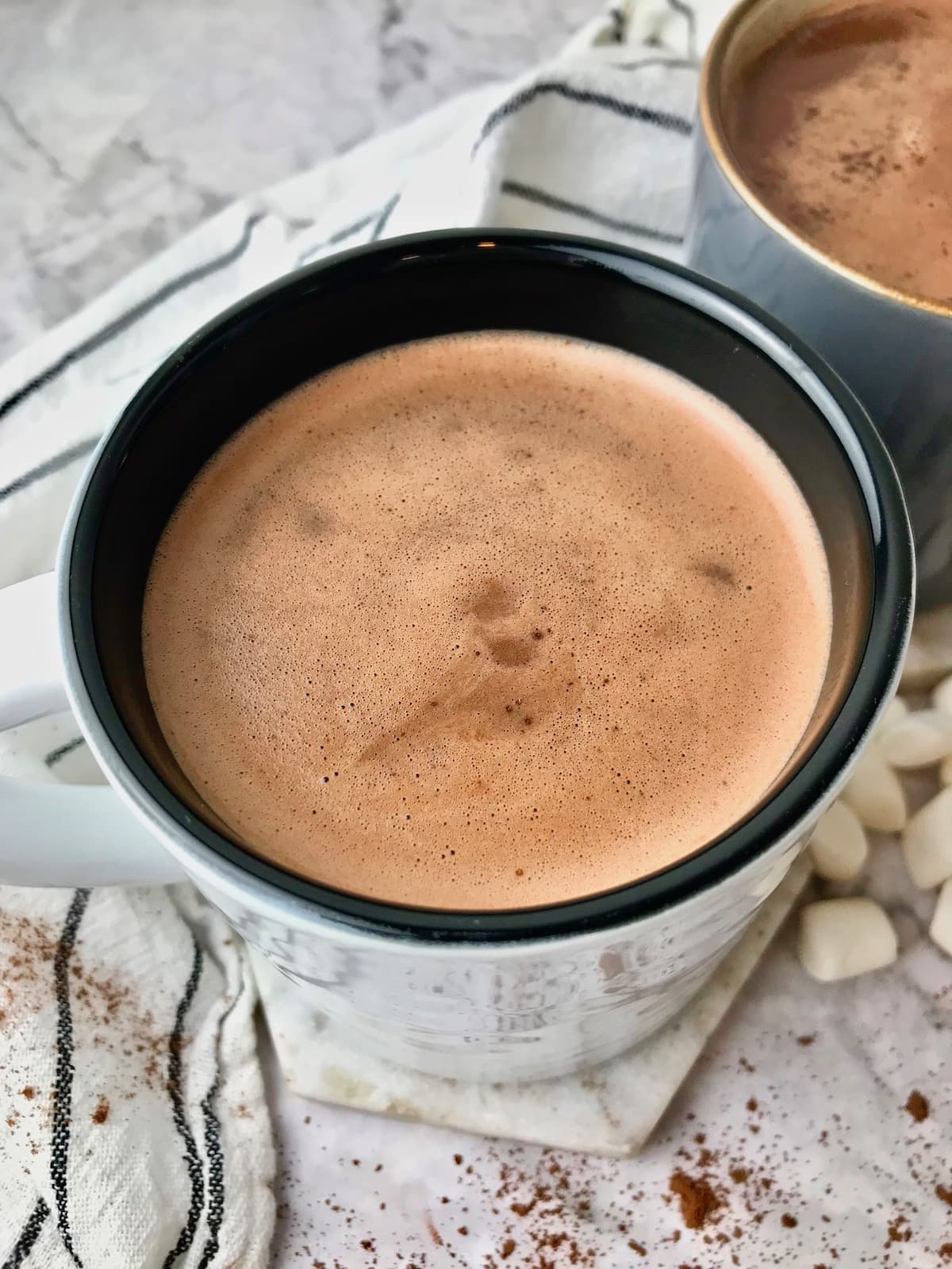 A mug of oat milk hot chocolate.