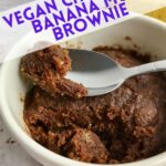 A spoon in a chocolate mug cake with text that says Vegan Chocolate Banana Mug Brownie.