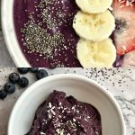 Two bowls of frozen blended acai smoothie topped with fruit.