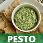 Vegan pesto is a small bowl next to baked tortilla chips with text that says Pesto.