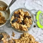 Overhead view of granola with raisins in a jar