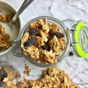 Overhead view of granola with raisins in a jar