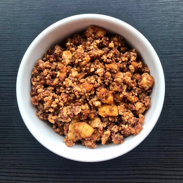 Bowl of orange tofu taco crumble. 