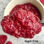 Spoonful of red raspberry jam with text, "Raspberry Jam Sugar-Free."