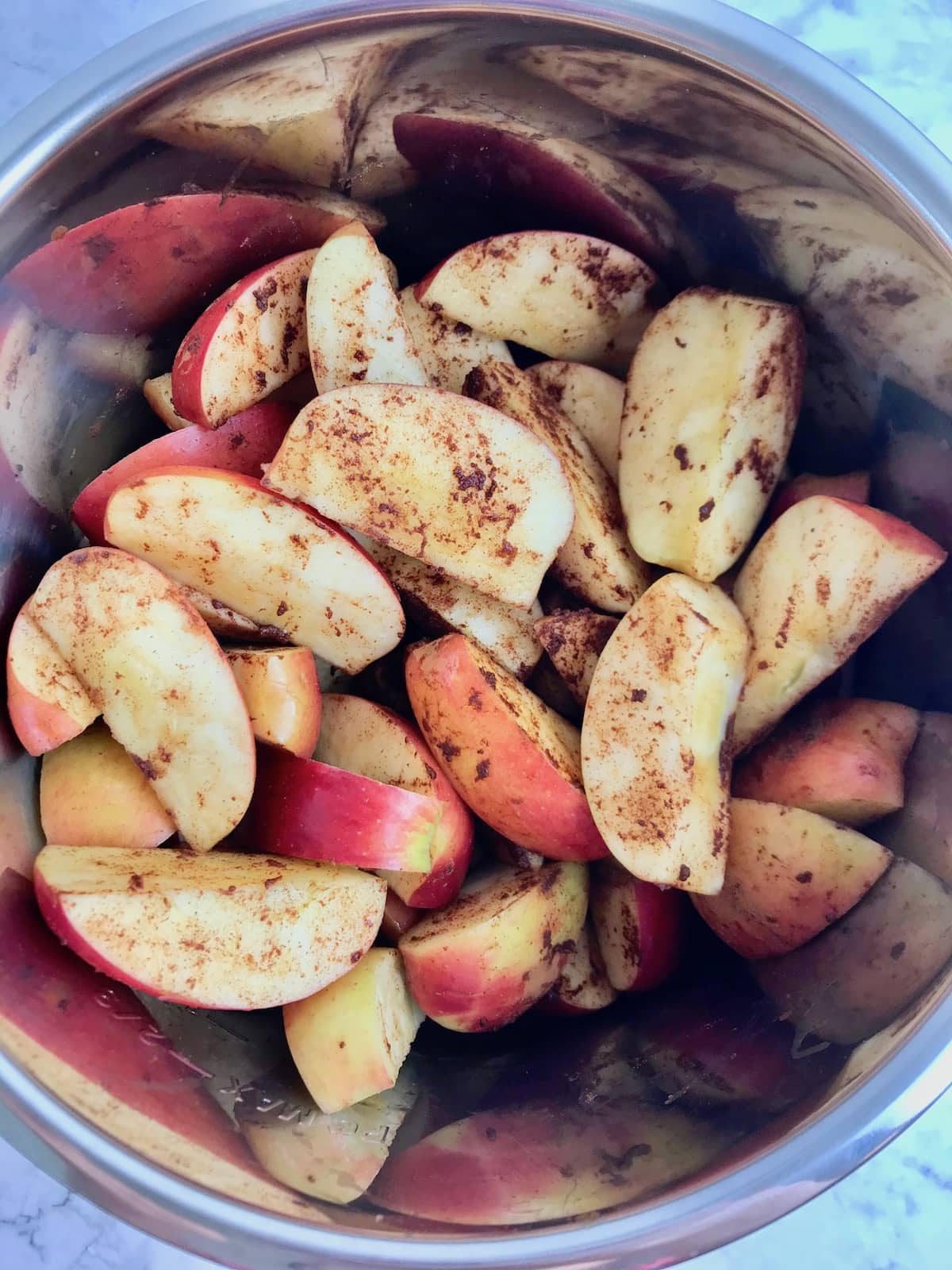 Apple slices and cinnamon in an instant pot.