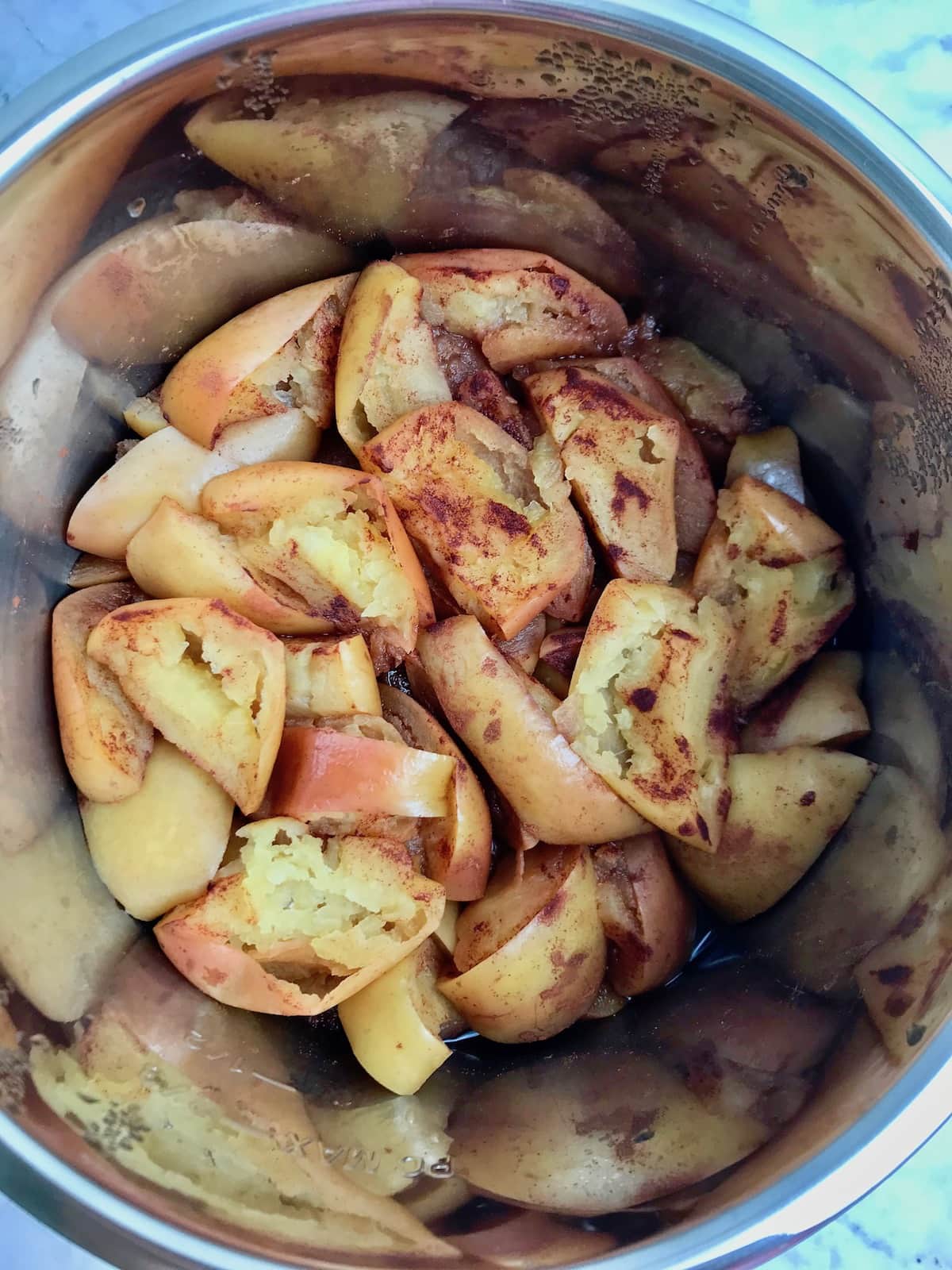 Soft, cooked apple slices and cinnamon in an instant pot.