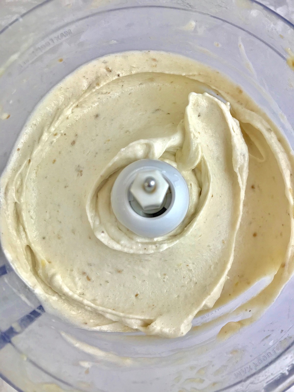 Blended frozen bananas in a food processor.