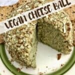 A cheese ball covered in nuts with text that says Vegan Cheese Ball.