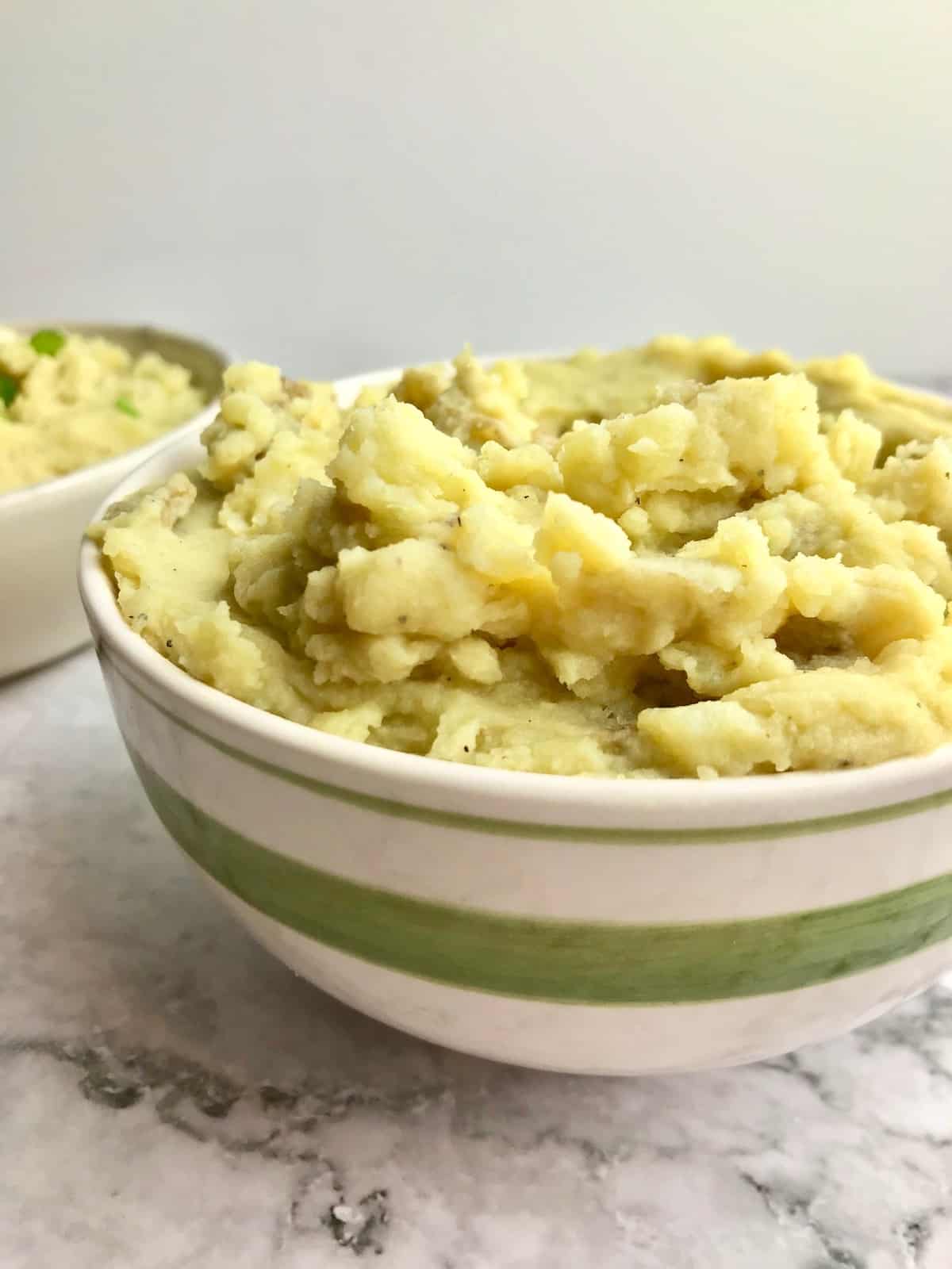 A bowl of vegan yellow mashed potatoes.