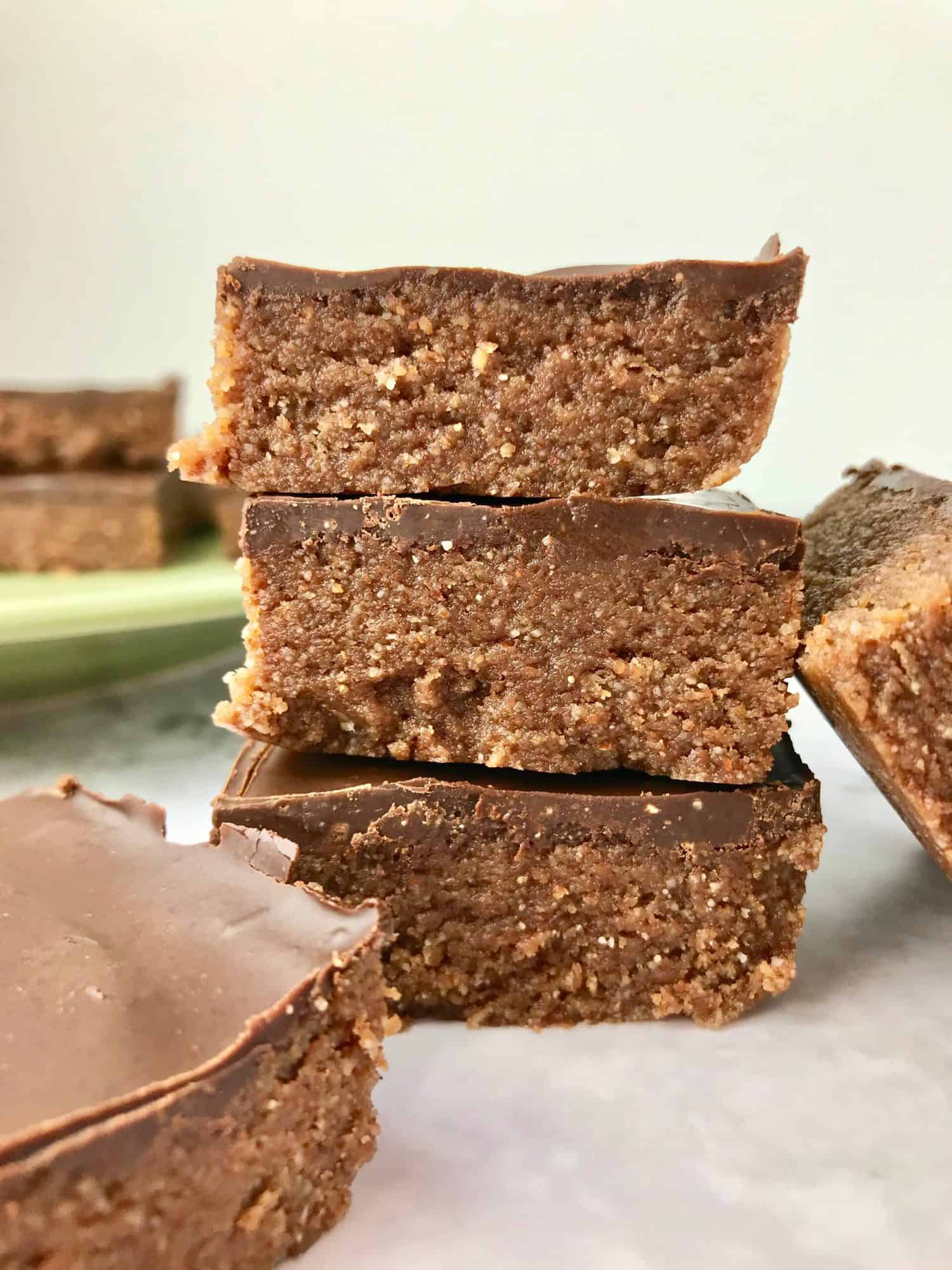 A stack of three chocolate almond butter bars.