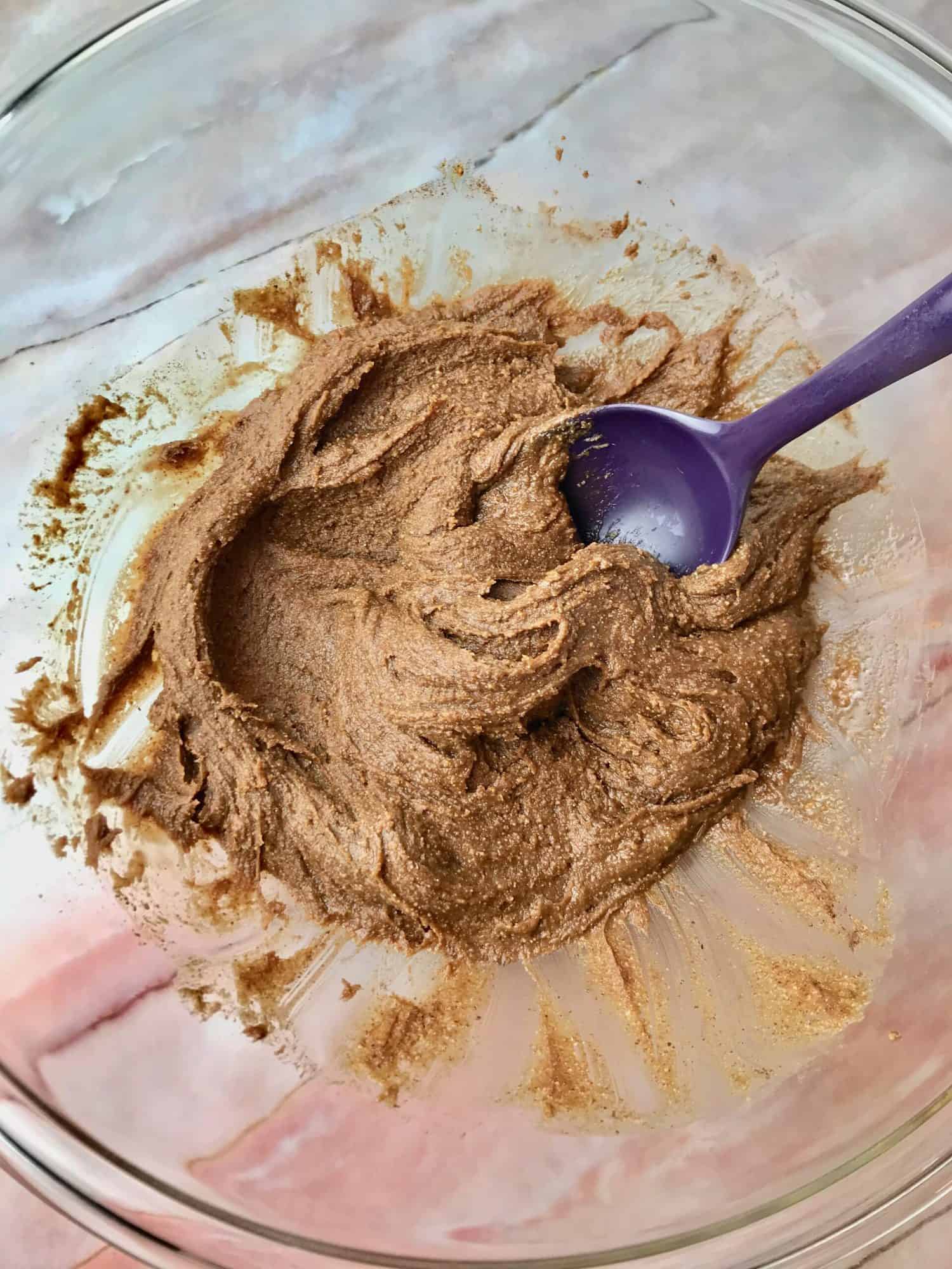 Almond butter mixture in a bowl with a spoon.