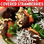 Chocolate dipped strawberries with chopped peanuts and coconut flakes on top.