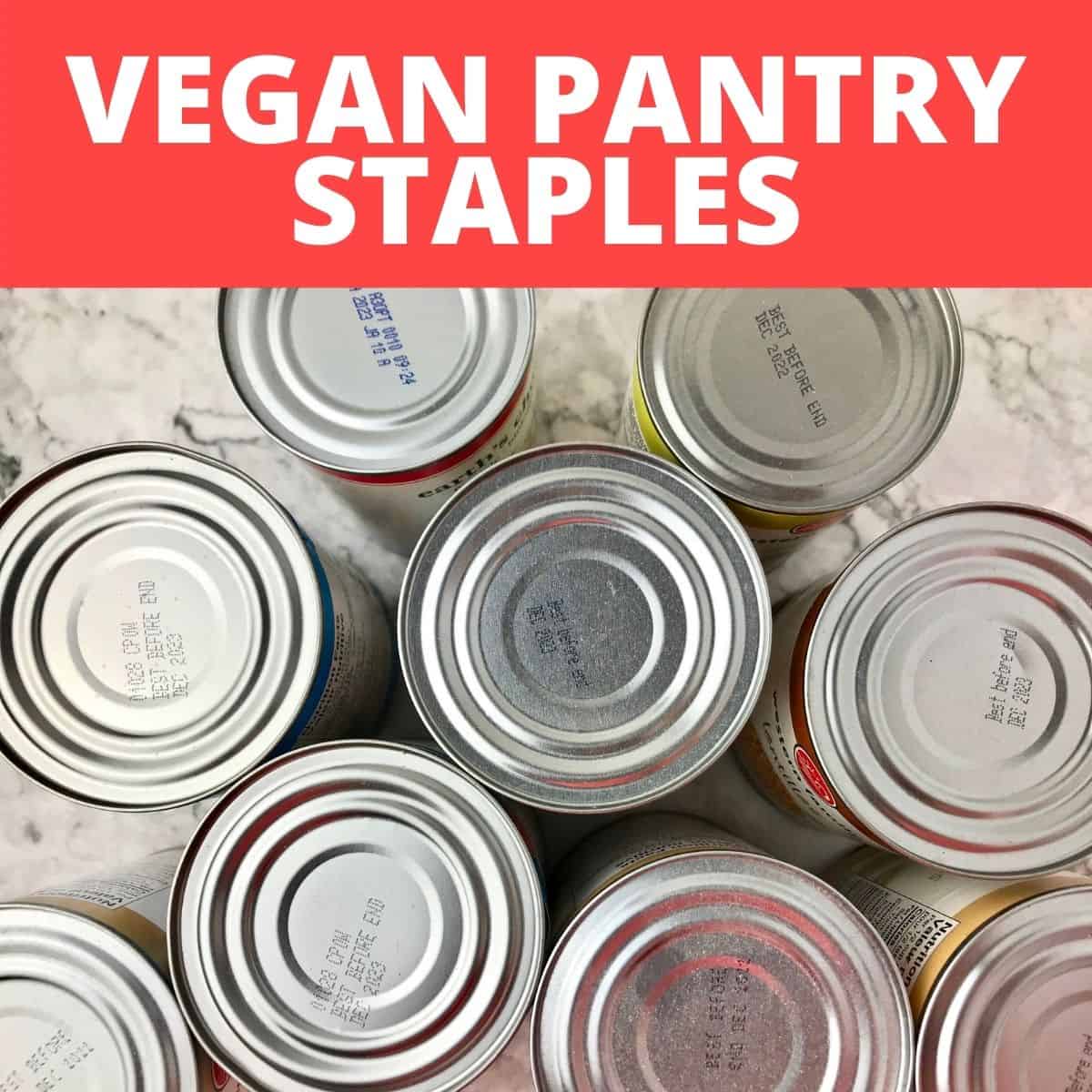 The tops of several tin cans below text that says, "Vegan Pantry Staples."