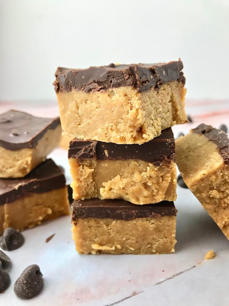 A stack of three chocolate peanut butter bars.