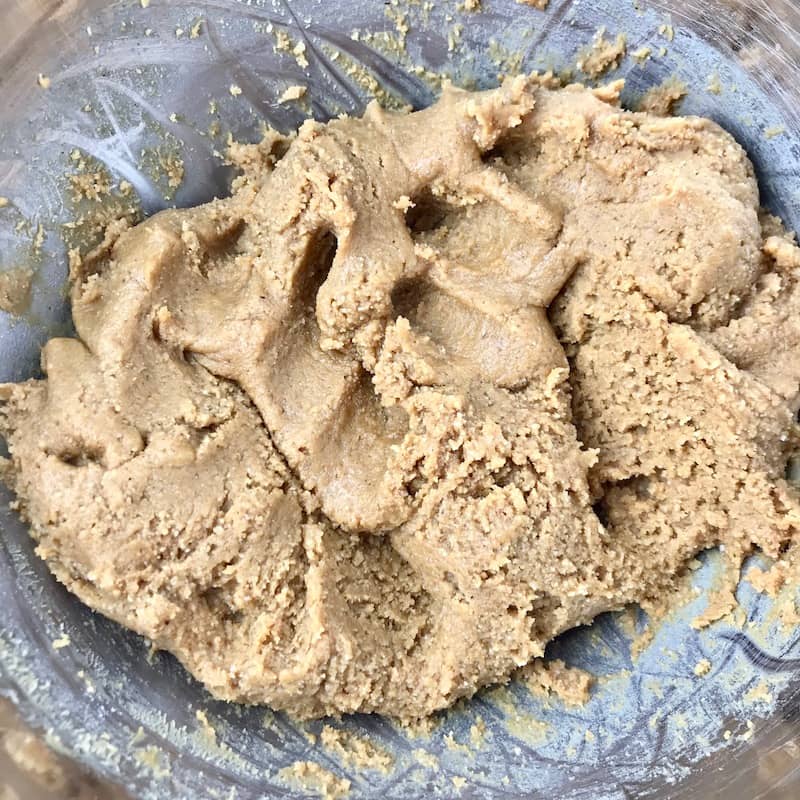 A peanut butter dough in a bowl.