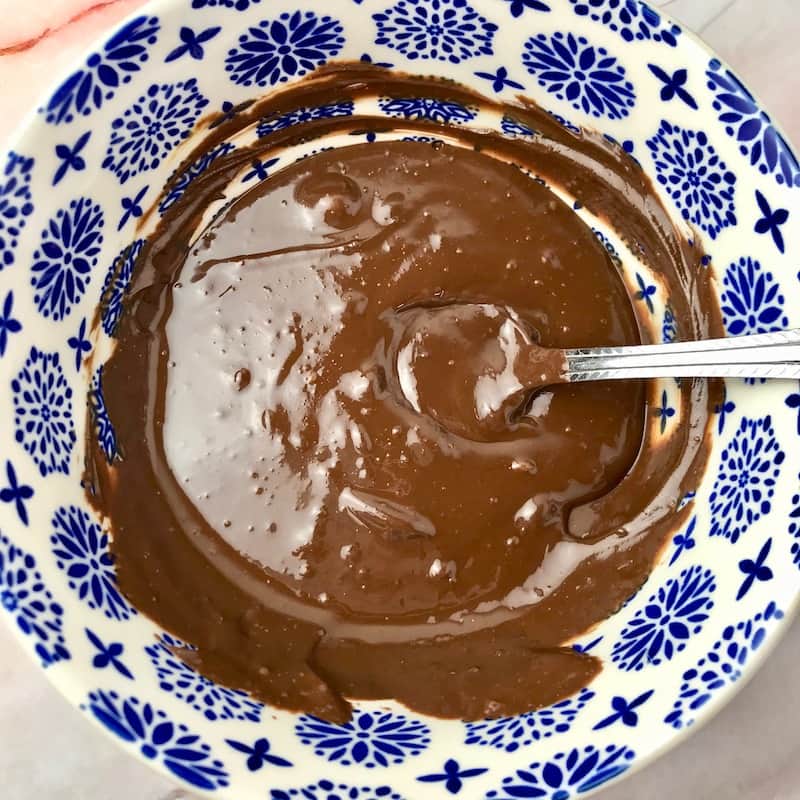 Melted chocolate and peanut butter in a bowl.