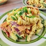 A plate of hummus pasta salad.