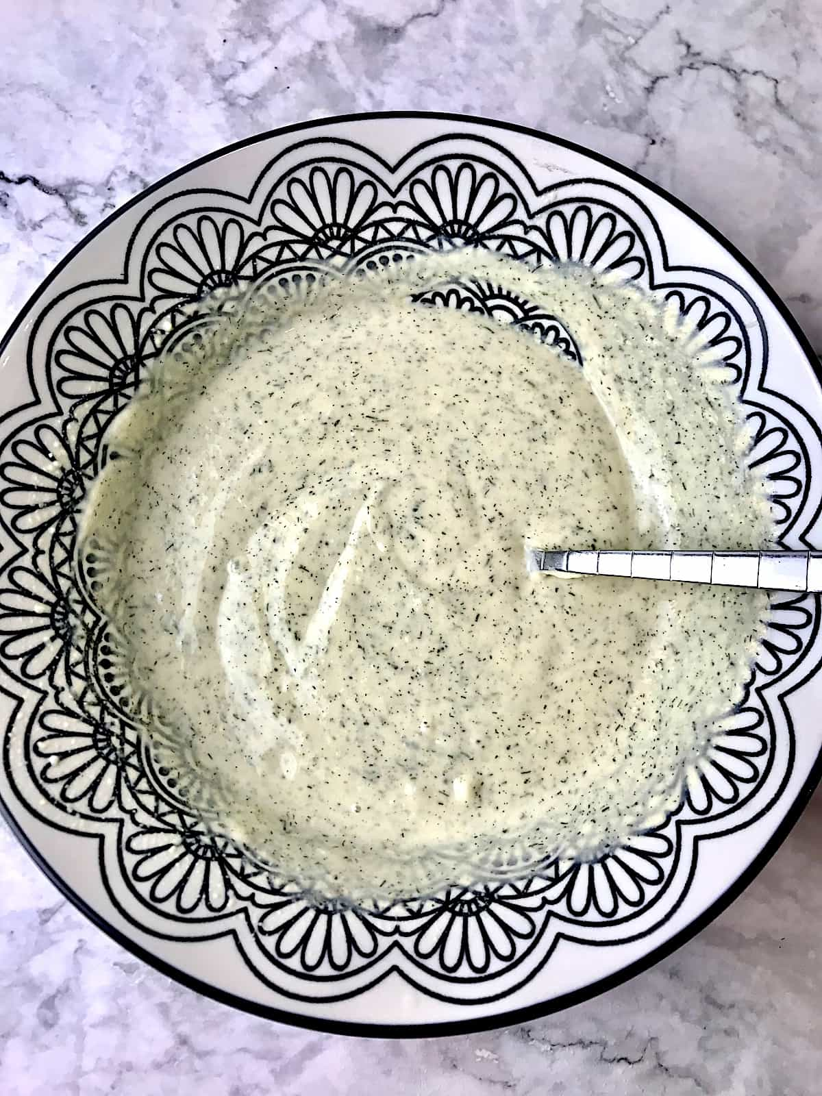 A bowl of hummus dressing.