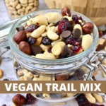 A glass jar of trail mix with text that says," Vegan Trail Mix."