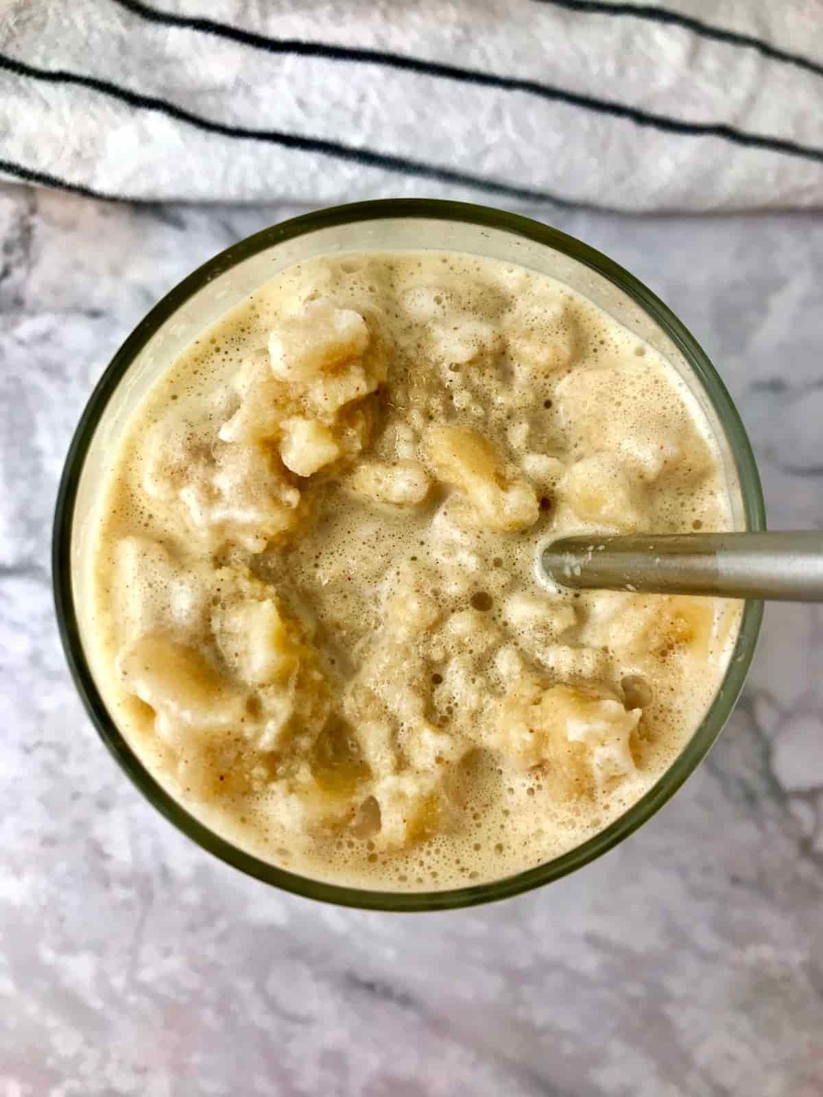 Overhead view of a glass of frozen peanut butter coffee.