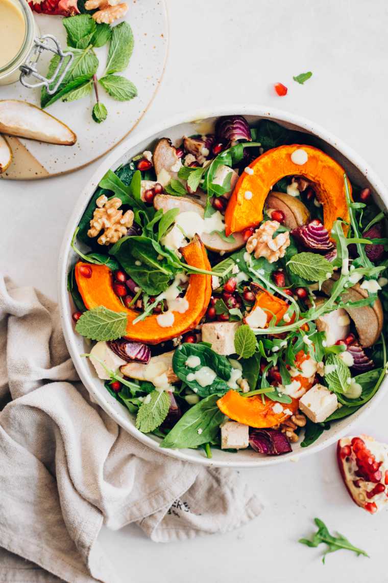 A vegan pumpkin feta salad in a bowl.