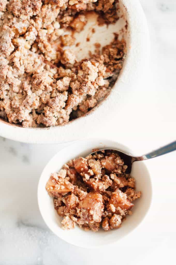 Two bowls of vegan apple crisp.