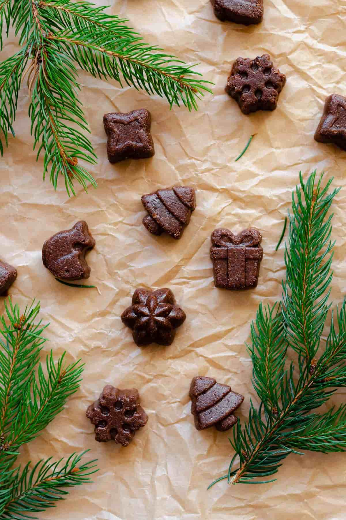 Small vegan fudge bites in Christmas-themed shapes.