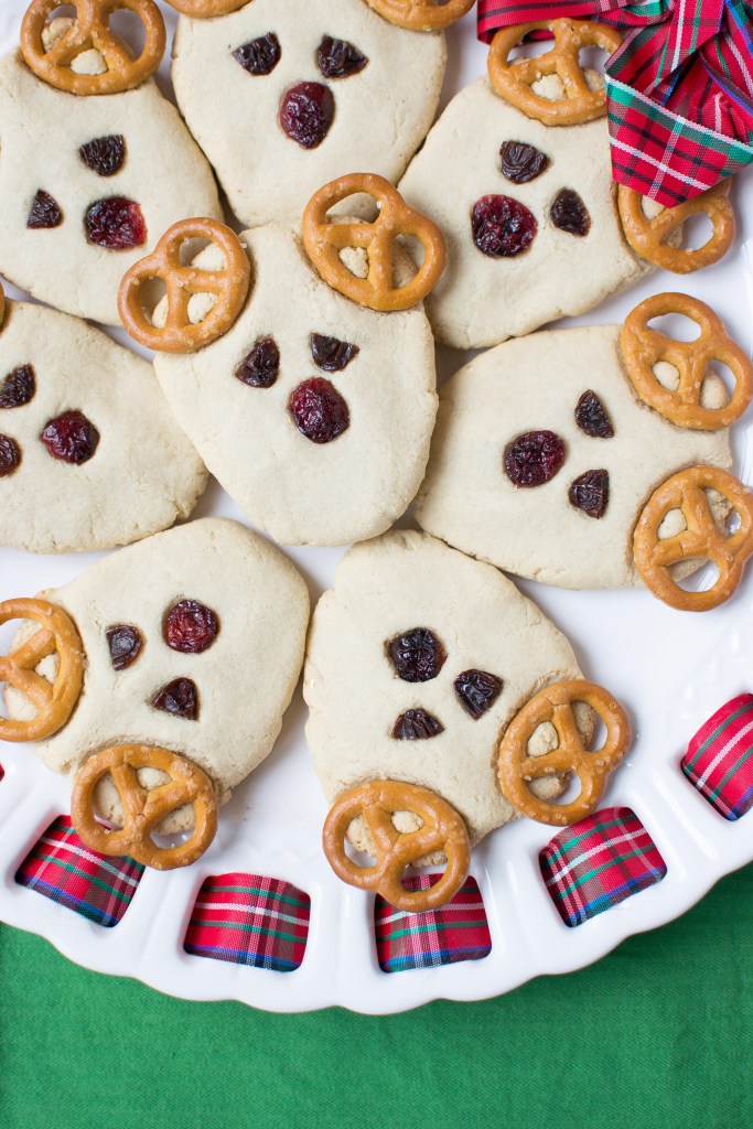 Reindeer cookies with craisin noses and pretzels for ears.