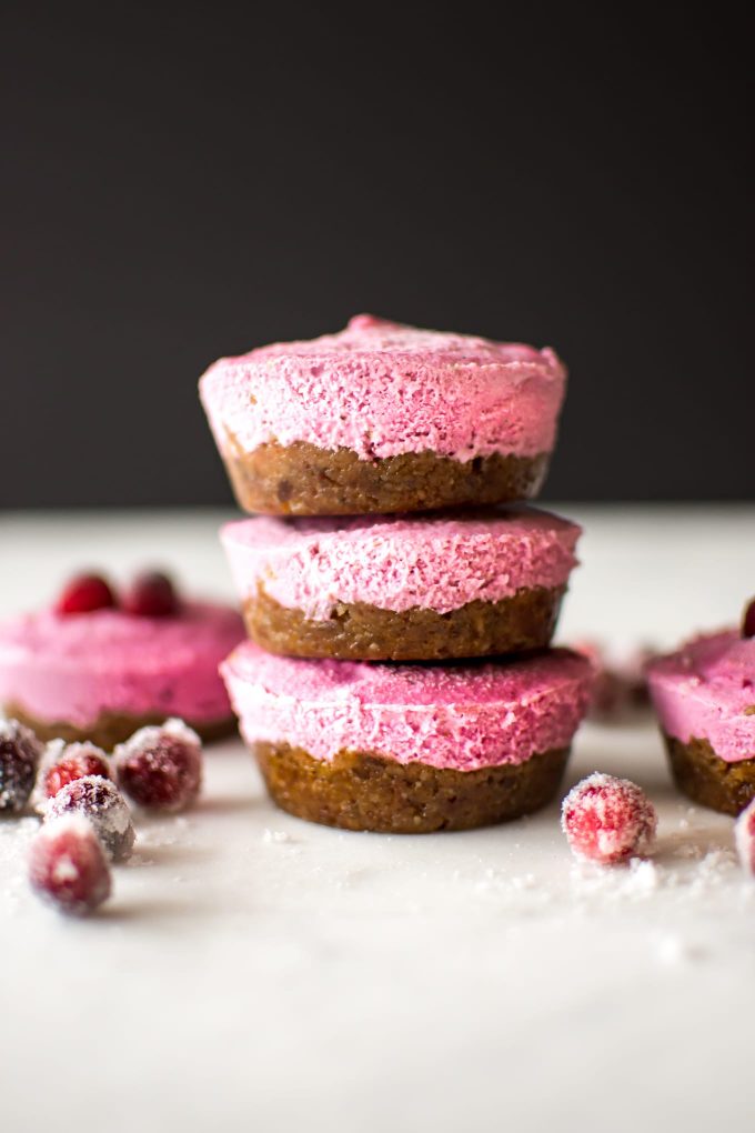 A stack of no-bake mini cranberry cheescakes.