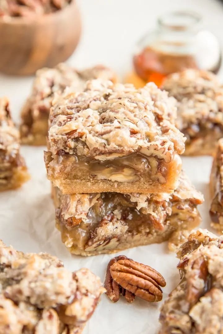 Several square pecan bars.