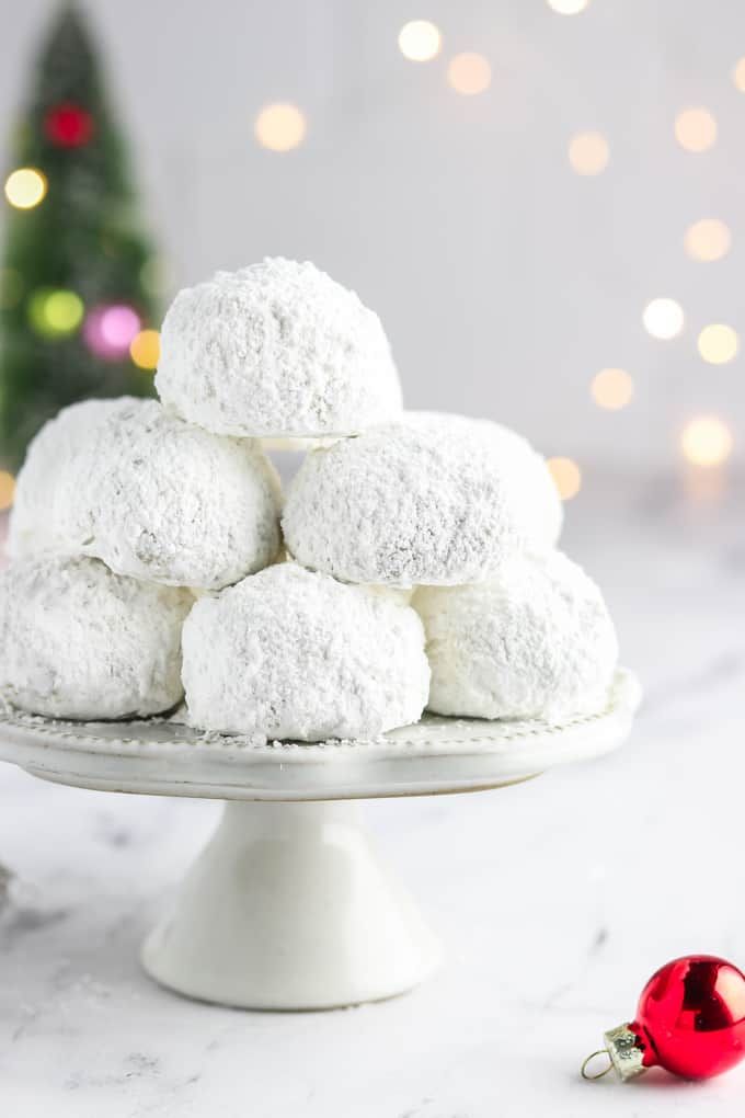 A platter of round white snowball cookies.