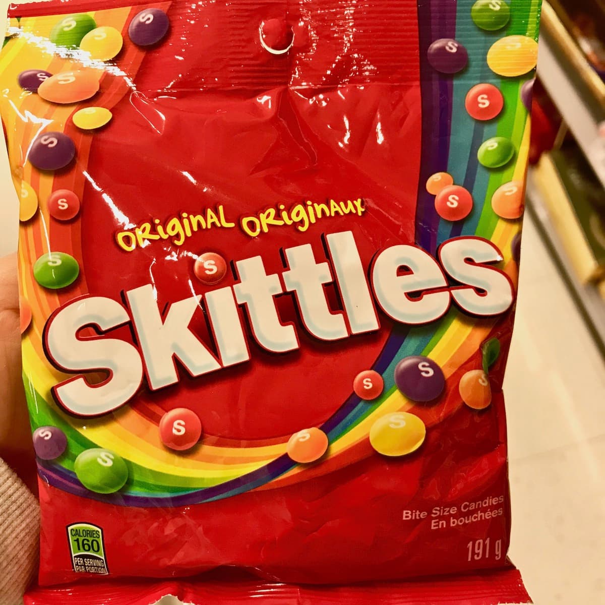 A red package of Original Skittles.