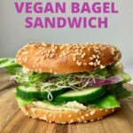 A bagel filled with veggies and vegan cream cheese, with text that says Vegan Bagel Sandwich.