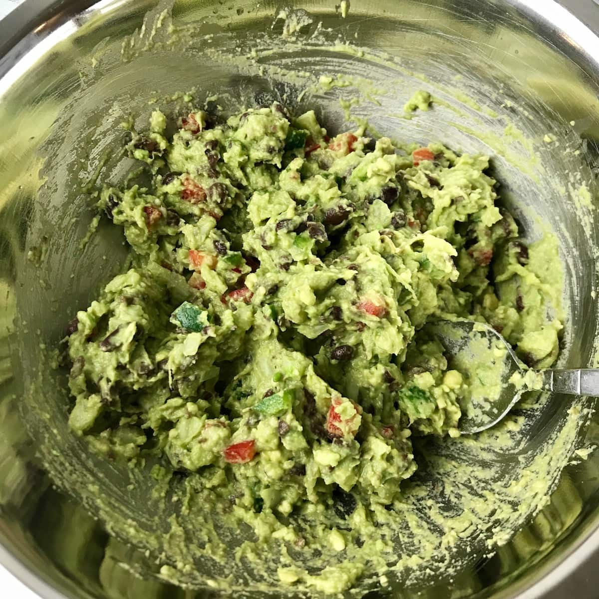 A bowl of black bean guacamole.