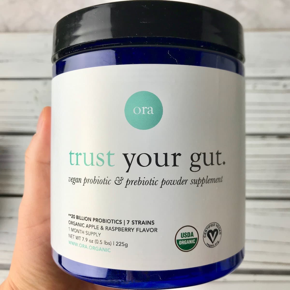 A container of vegan probiotic powder.