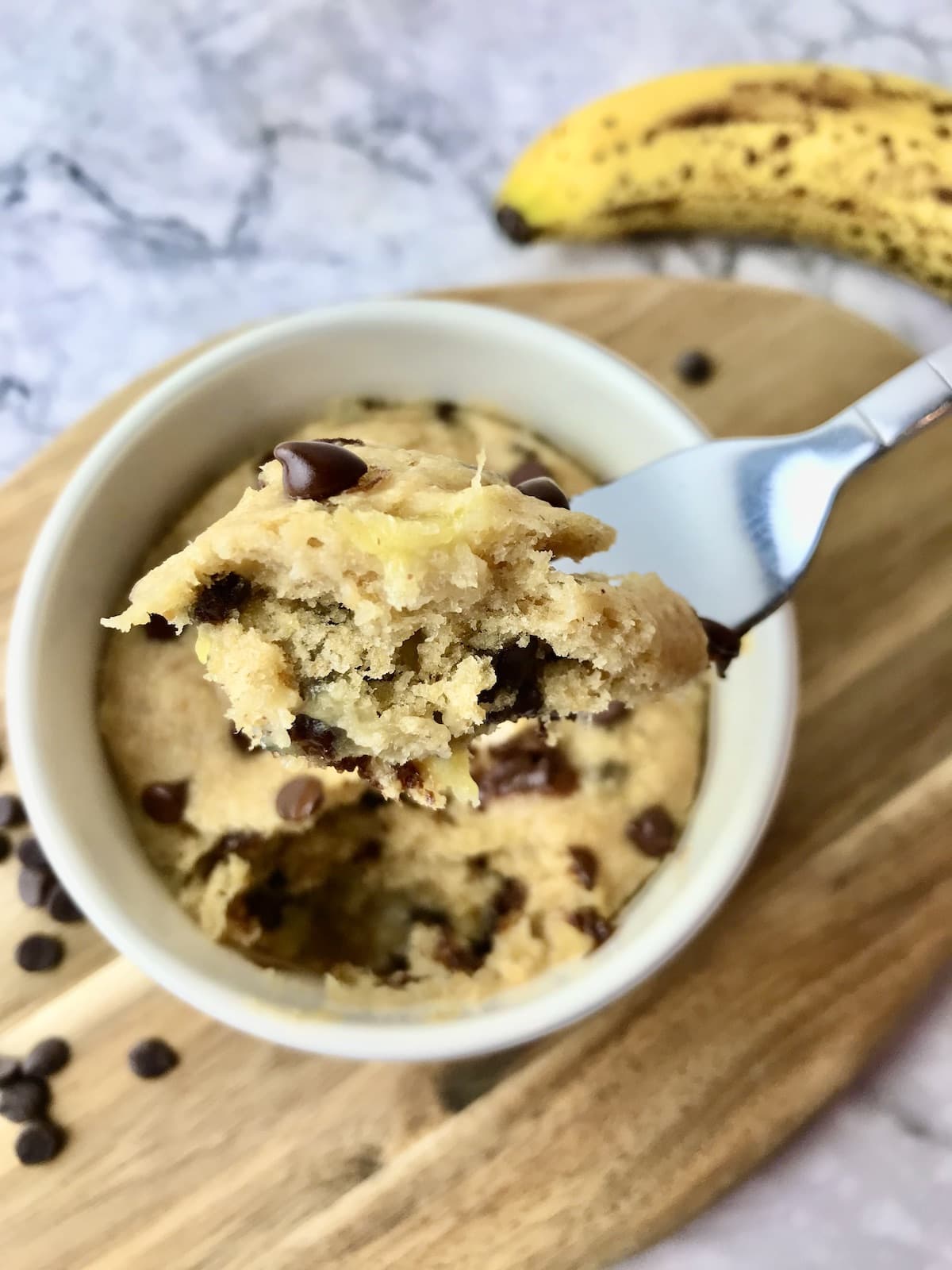 A forkful of a banana chocolate chip mug cake.