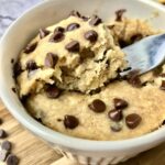 A fork in a banana chocolate chip mug cake.