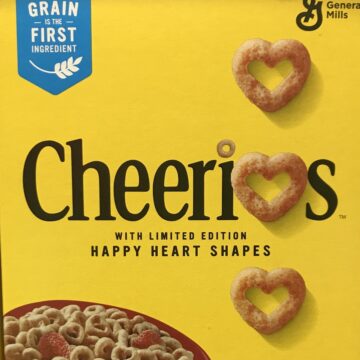 The front of a box of Cheerios.