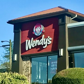 A Wendy's sign on a building.