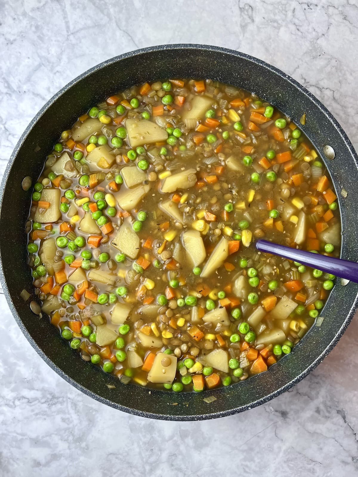 A pot of vegan potato lentil stew.